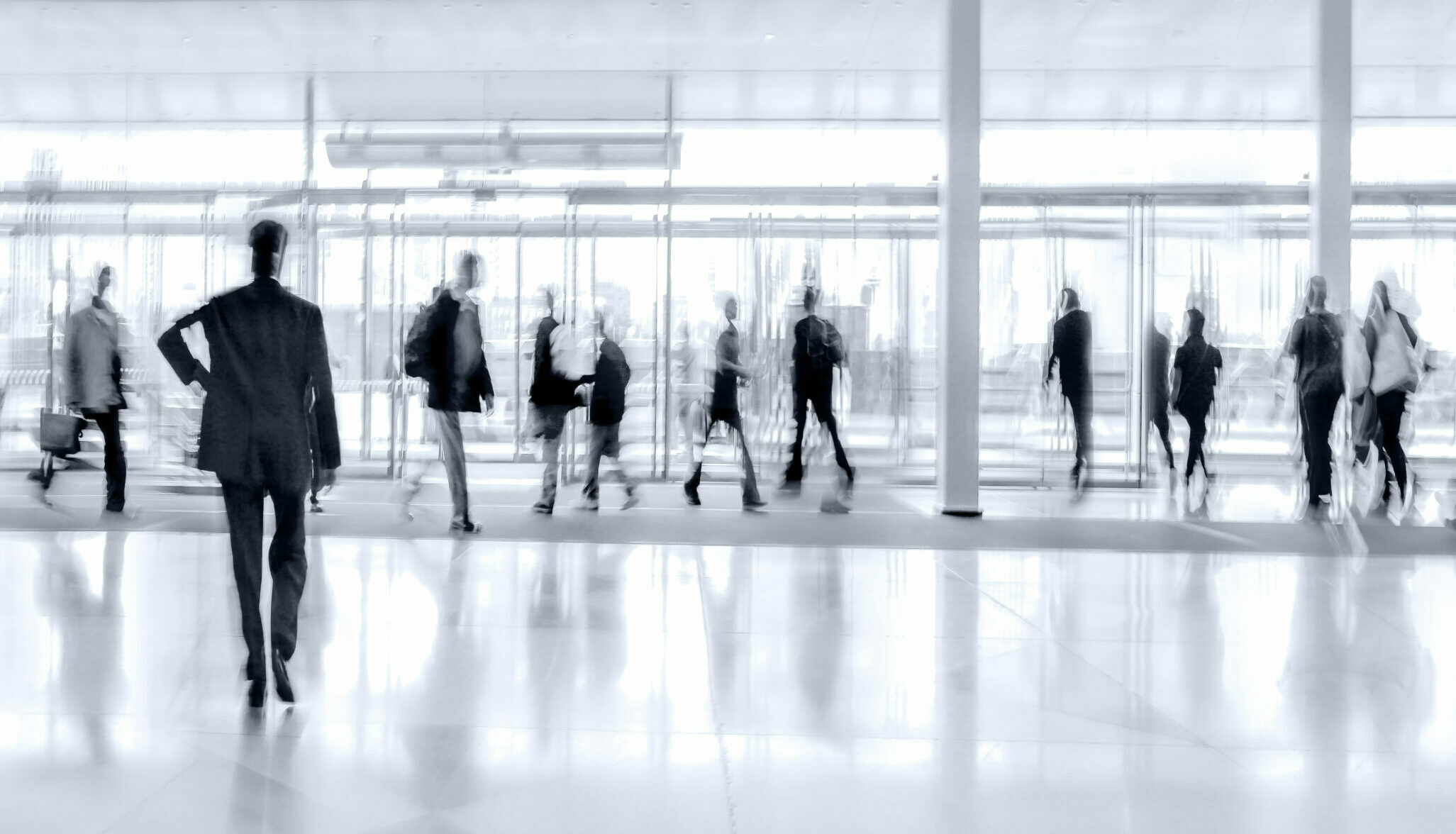 group of people in the lobby business center in monochrome blue